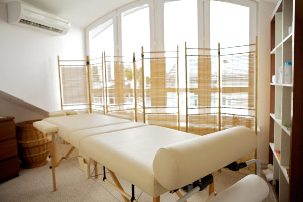Empty massage table in room
